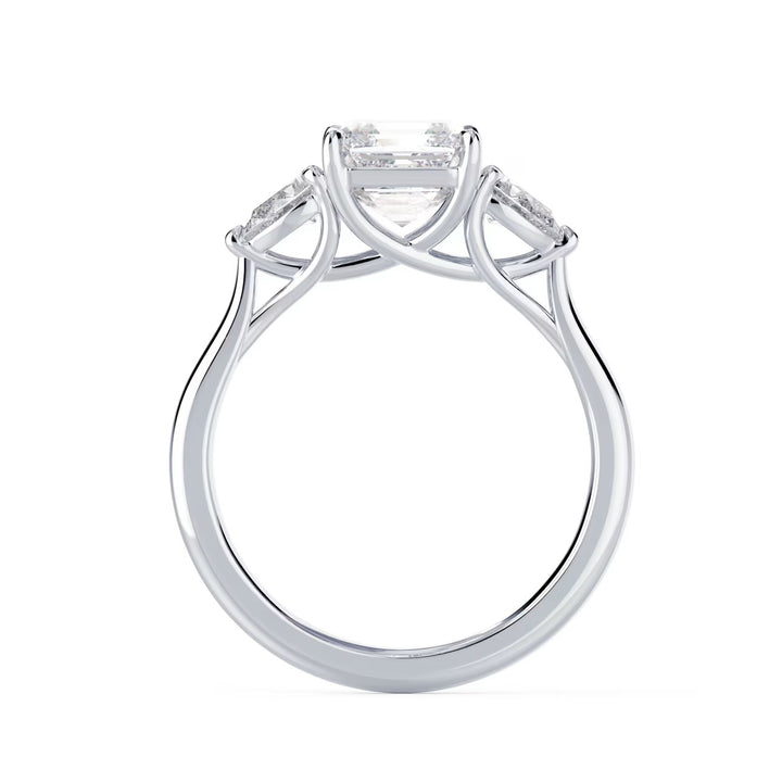 Close-up of Asscher cut lab grown diamond three stone engagement ring with E VS2 clarity and geometric step-cut sparkle