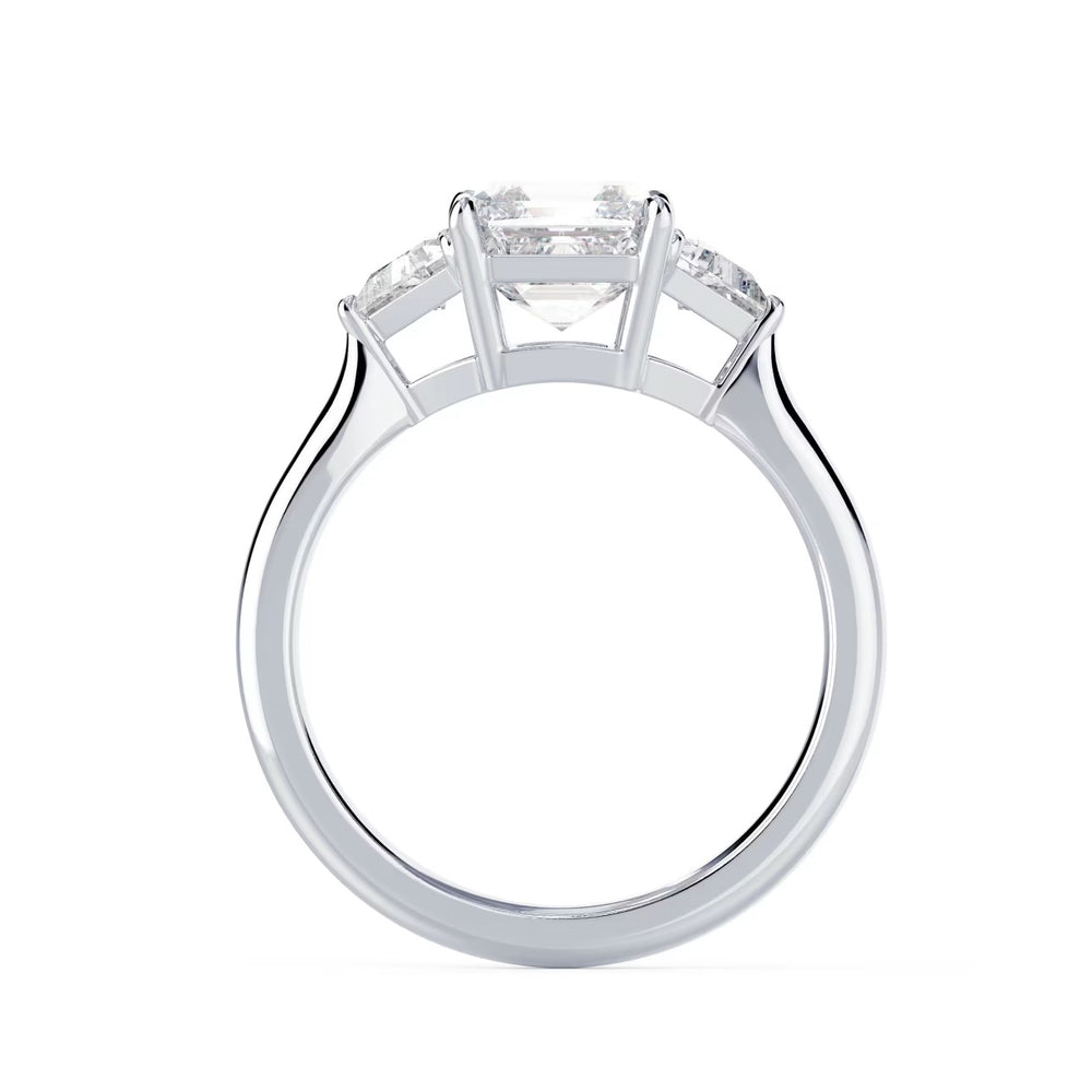 Close-up sparkle of Asscher cut lab grown diamond three stone engagement ring with E VS1 clarity and geometric step-cut brilliance