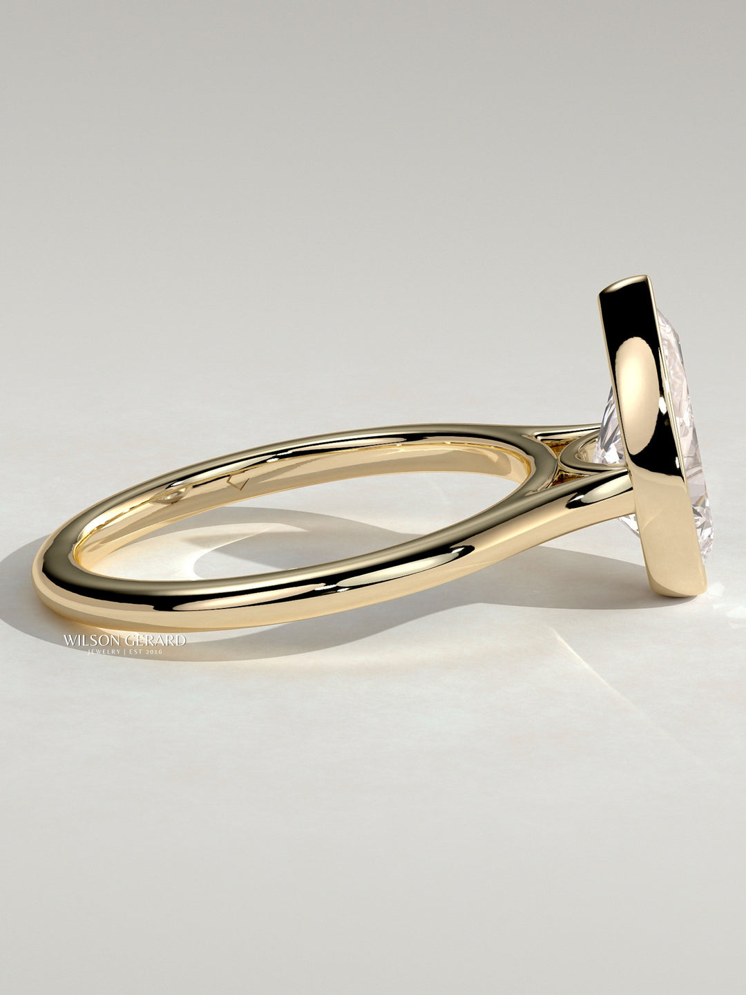 lab grown pear bezel engagement ring