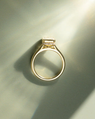 Radiant cut lab diamond engagement ring featuring a hidden halo beneath the center stone and a sleek bezel frame