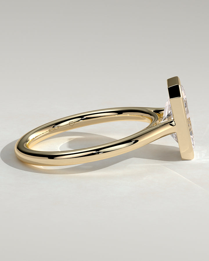 Bezel Solitaire Engagement Ring featuring an Open Cathedral High Setting
