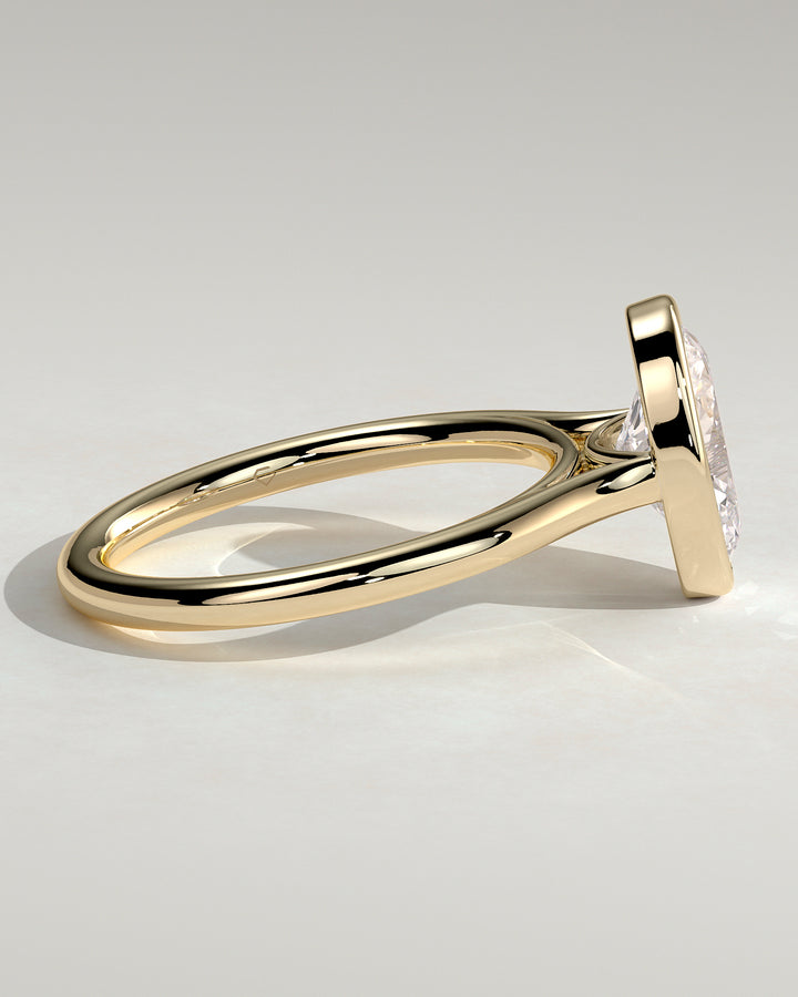 Cathedral bezel solitaire engagement