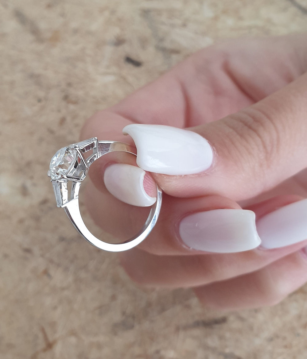 Round Engagement Ring with Side Stones