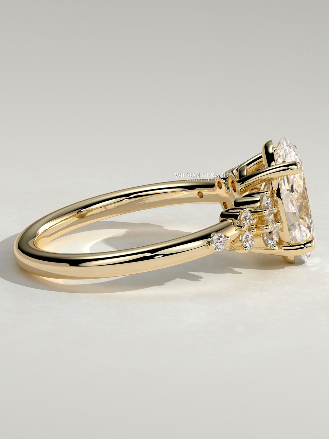 modern oval cluster engagement ring