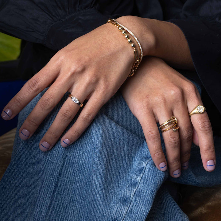 Contemporary engagement ring featuring east west marquise lab grown diamond cigar band design with bold modern clean lines