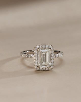 Contemporary emerald cut lab grown diamond halo pavé engagement ring featuring a modern bridal aesthetic and clean finish