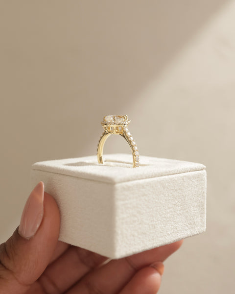 Contemporary pear lab grown diamond halo cathedral pavé engagement ring featuring a modern bridal aesthetic and clean lines