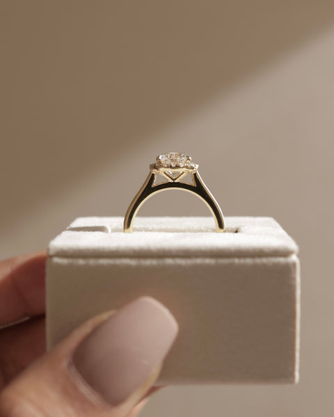 Contemporary round lab grown diamond halo solitaire engagement ring featuring a modern bridal aesthetic and clean design lines