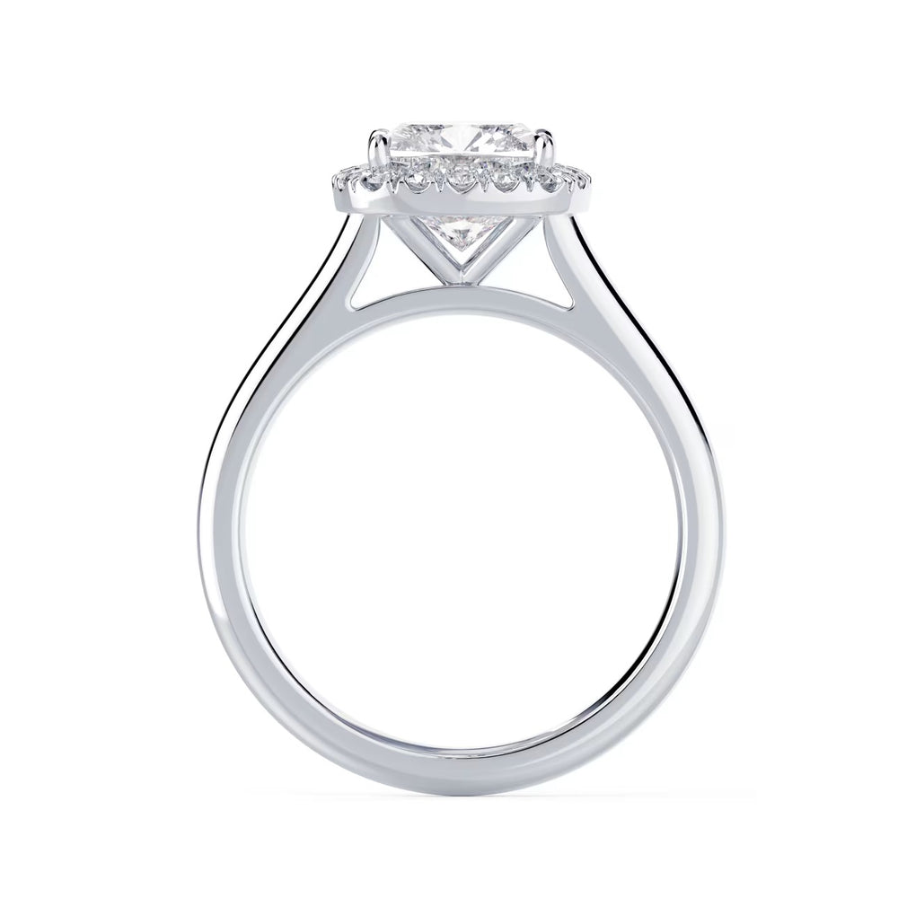 Close-up of an elongated cushion lab grown diamond halo solitaire engagement ring highlighting soft rectangular sparkle