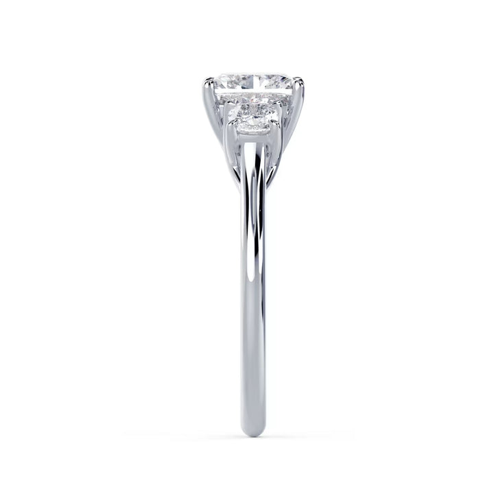 Side profile of cushion cut lab grown diamond three stone engagement ring highlighting elegant prong setting and craftsmanship
