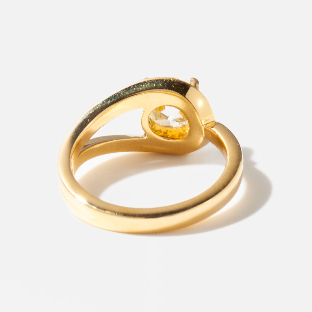 Side profile of a cushion cut lab grown diamond solitaire engagement ring showing sleek minimal band design