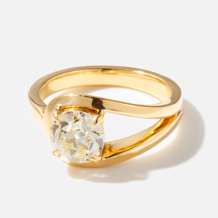 Detailed view of an E VS1 cushion cut lab grown diamond solitaire engagement ring with modern unique structure