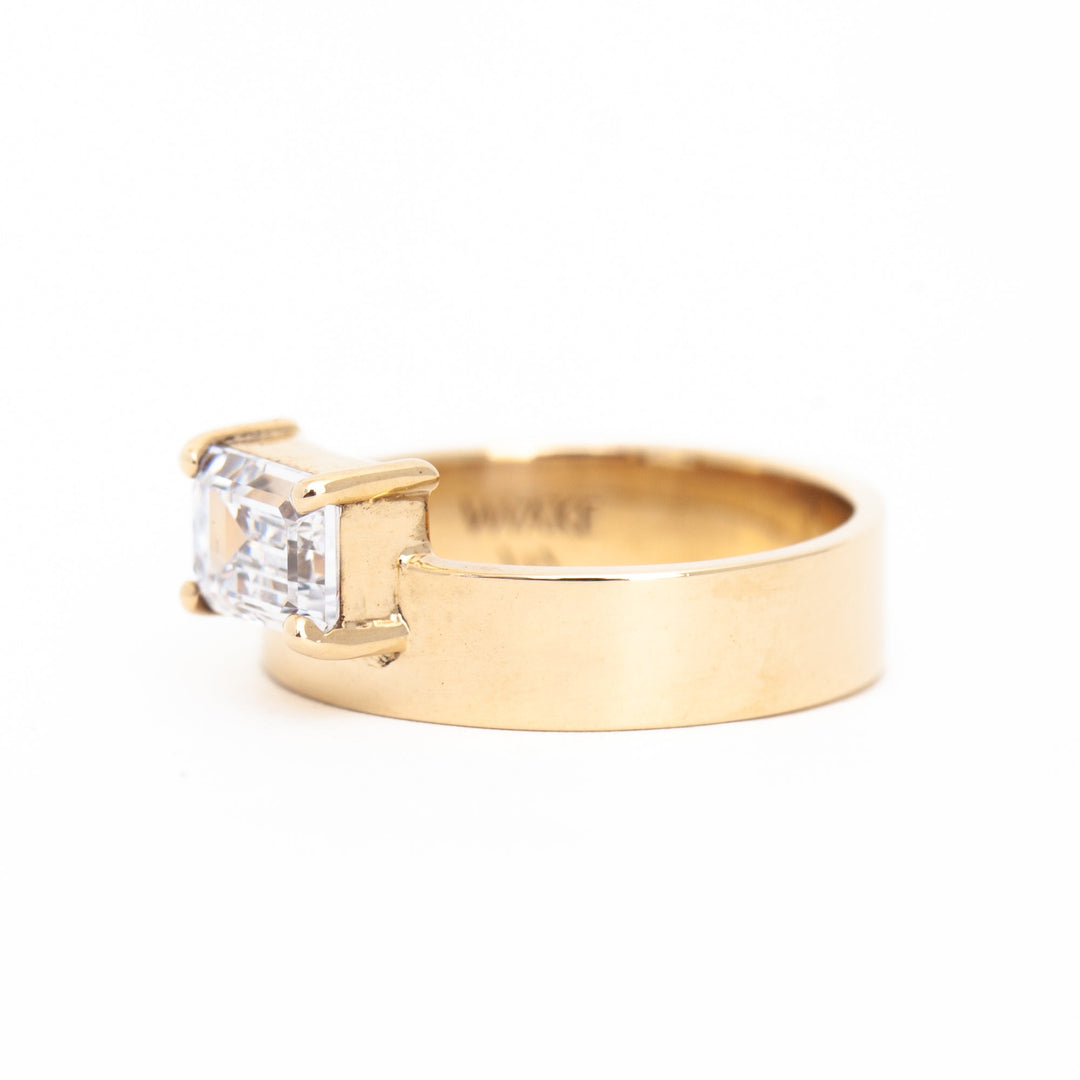 E VS1 east west emerald cut lab grown diamond monolith engagement ring showing crisp step-cut clarity and refined structure