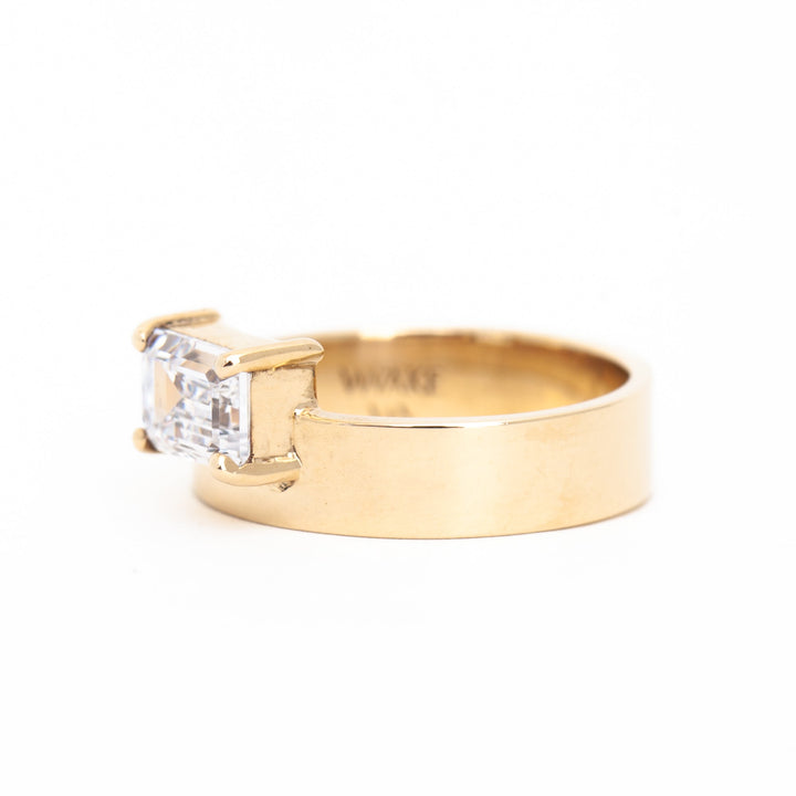 E VS1 east west emerald cut lab grown diamond monolith engagement ring showing crisp step-cut clarity and refined structure