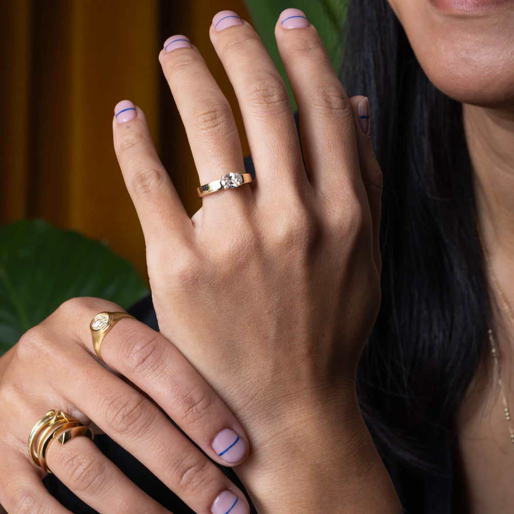E VS1 east west oval lab grown diamond cigar band solitaire engagement ring showing crisp clarity and refined structured setting