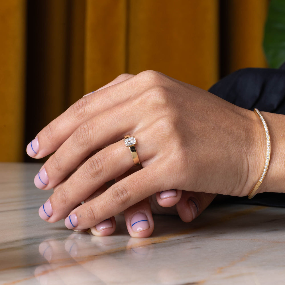 E VS1 emerald cut CVD lab grown diamond solitaire engagement ring showing crisp step-cut clarity and refined sparkle