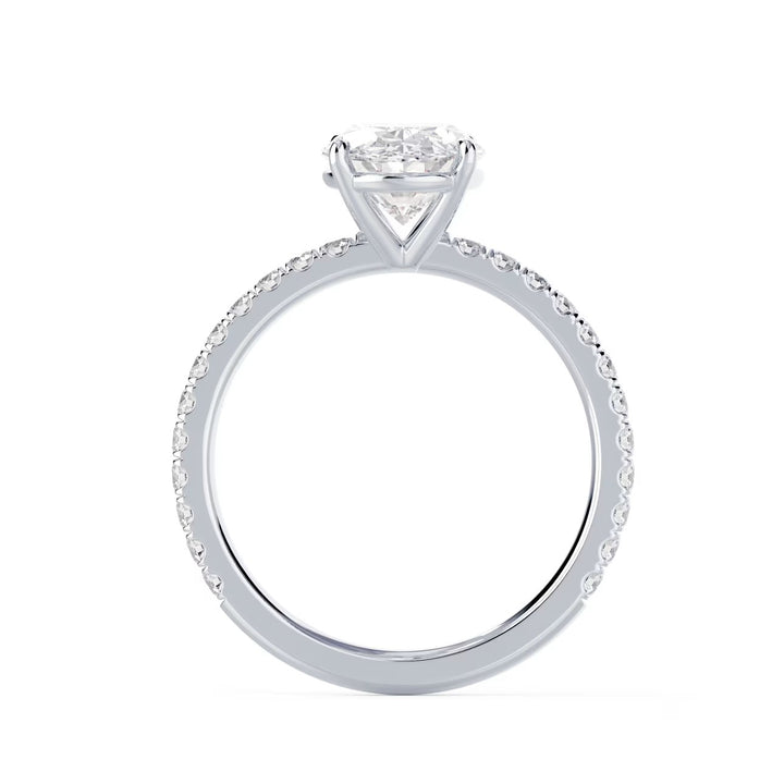 Detailed view of an E VS1 oval cut lab grown diamond pave engagement ring with elegant elongated symmetry and clarity