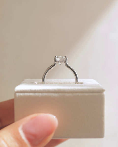 Detailed view of round E VS1 lab grown diamond hidden halo engagement ring showing precision craftsmanship and sparkle