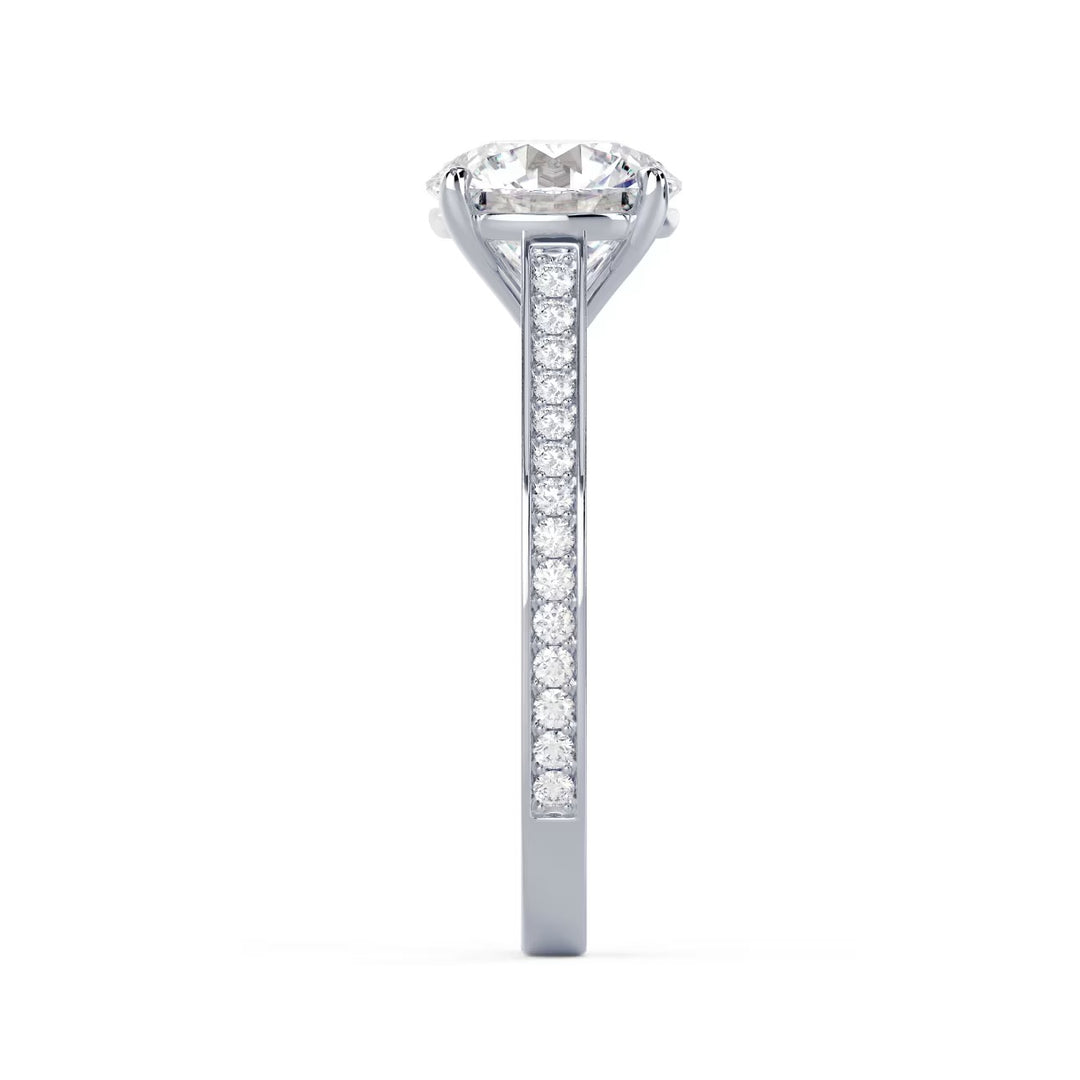 Detailed view of an E VS1 round cut lab grown diamond cathedral channel pave engagement ring with elevated structure