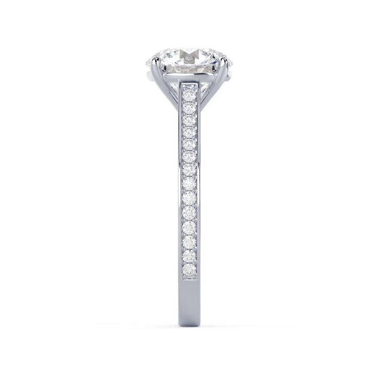Detailed view of an E VS1 round cut lab grown diamond cathedral channel pave engagement ring with elevated structure