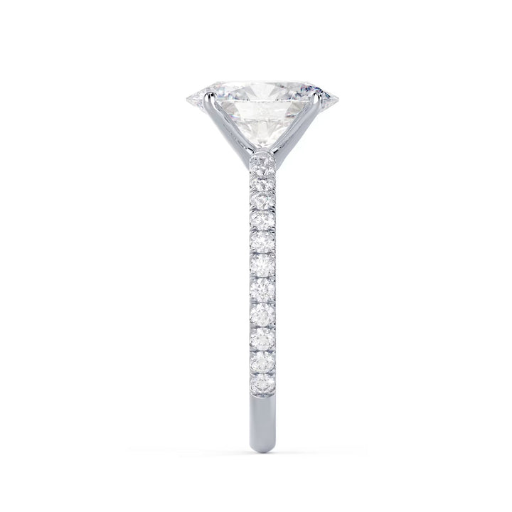 Detailed view of an E VS2 oval cut lab diamond pave engagement ring with elegant elongated shape and clarity