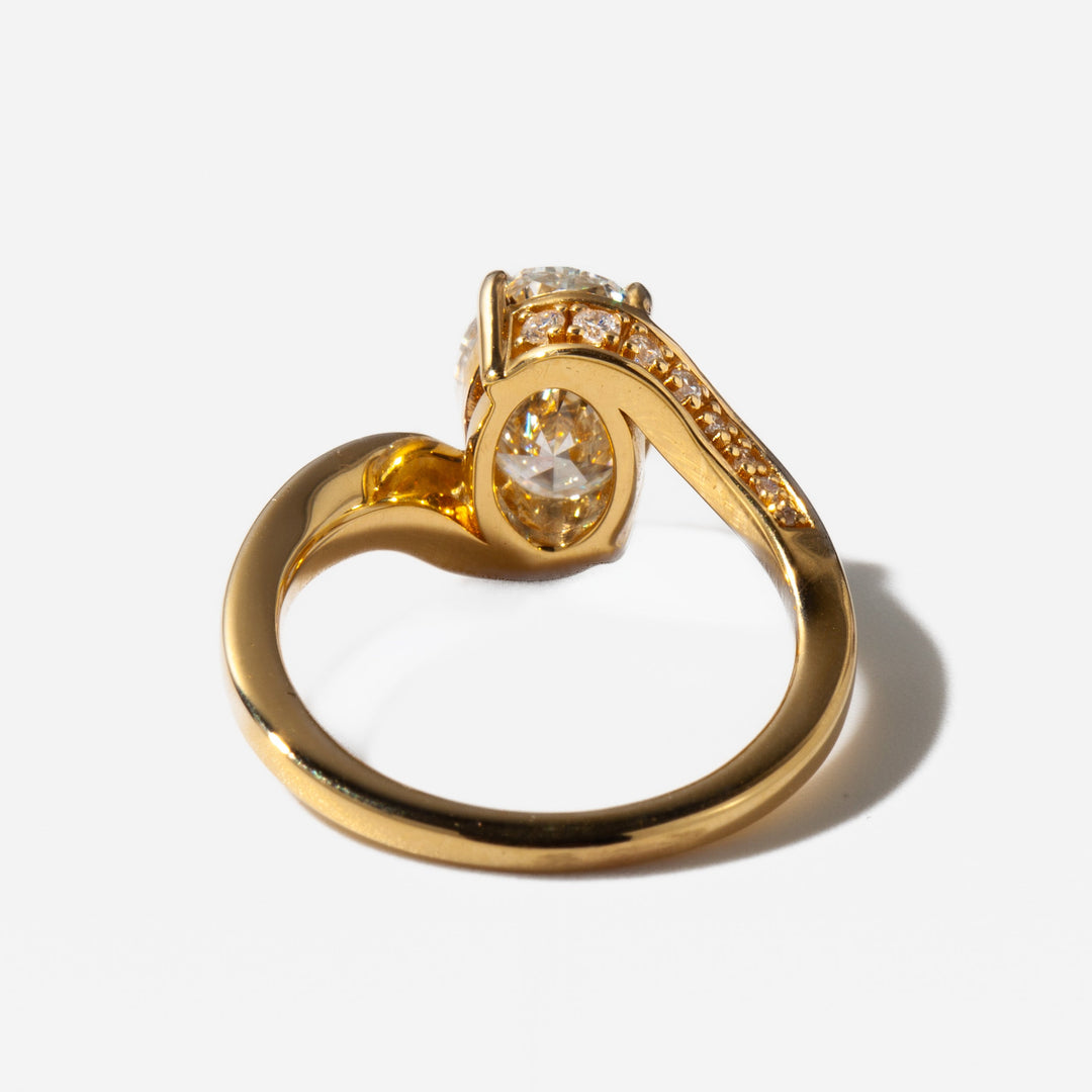 Detailed view of an E VS2 oval cut lab grown diamond tension engagement ring with open minimalist setting