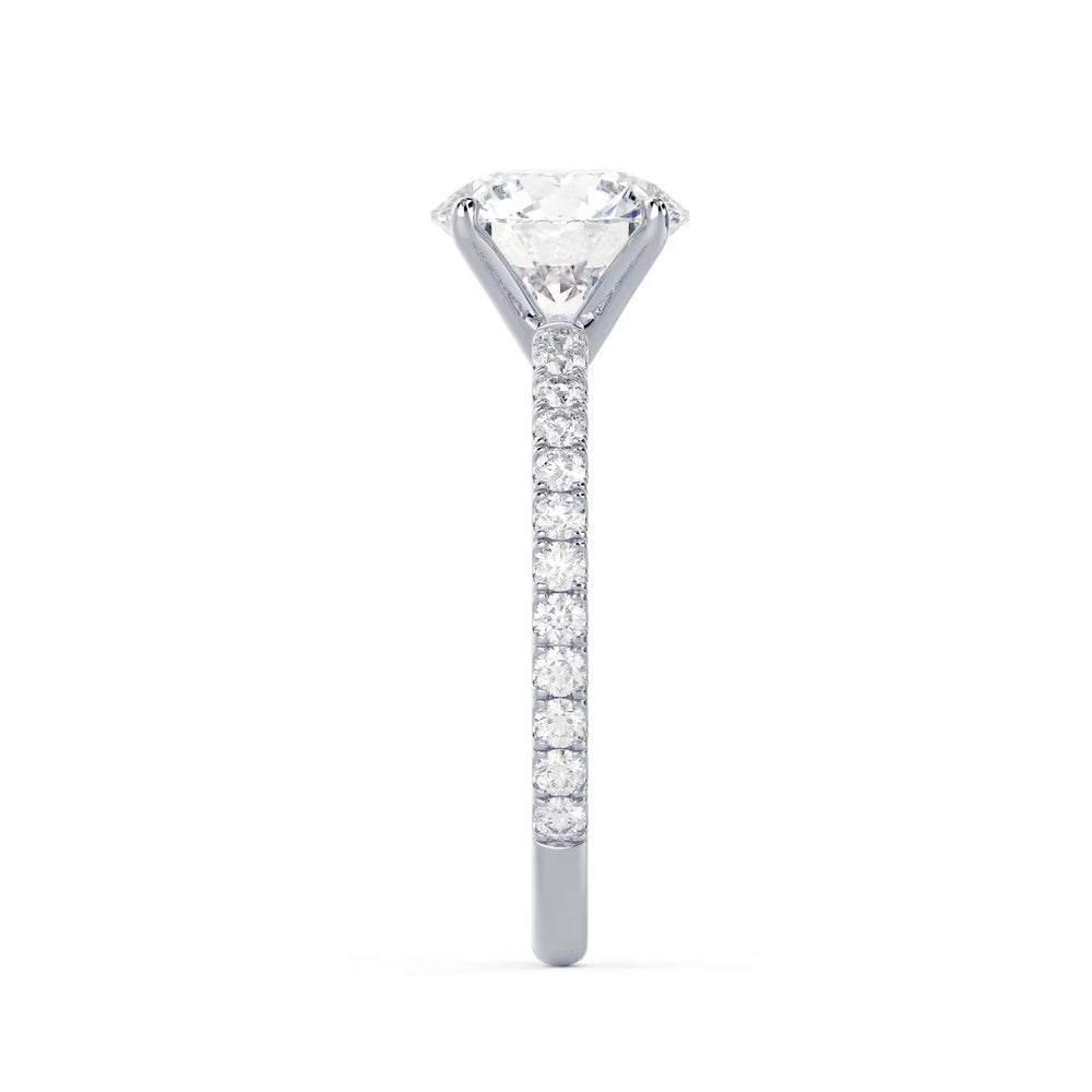 Detailed view of an E VS2 round cut lab grown diamond pave engagement ring with clean symmetry and strong brilliance