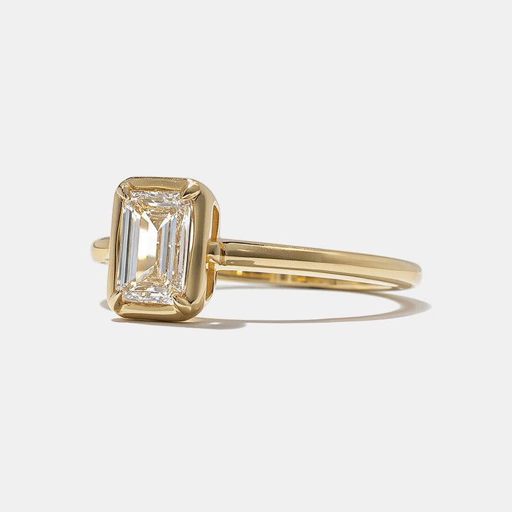 E VS oval lab grown diamond bezel engagement ring showing smooth edges and secure protective setting craftsmanship