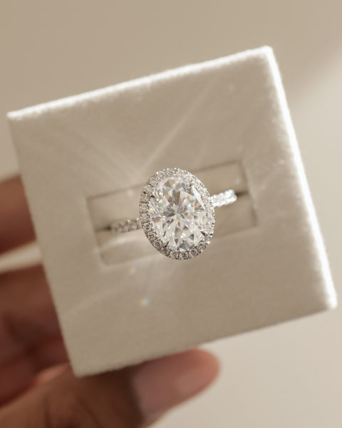 Detailed view of oval E VS lab grown diamond halo pavé engagement ring showcasing exceptional sparkle and craftsmanship