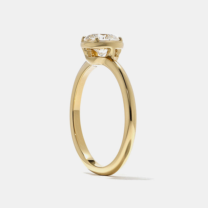 E VS round lab grown diamond bezel engagement ring showing clean edges and secure protective setting design