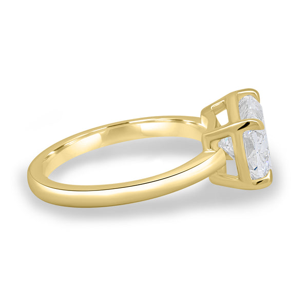 Side profile of bezel set elongated cushion lab diamond engagement ring highlighting horizontal orientation and sleek structure