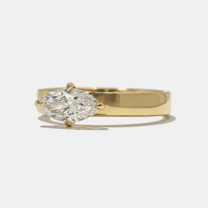 Close-up of east west marquise lab grown diamond cigar band engagement ring showing horizontal setting and modern wide band