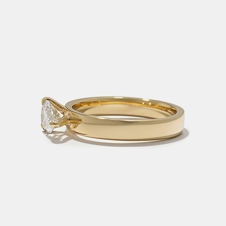 Close-up of east west pear lab grown diamond cigar band engagement ring showing horizontal setting and modern structure