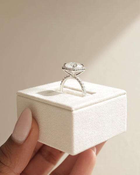 Elegant cushion cut lab diamond halo pavé engagement ring with refined proportions and sparkling romantic style
