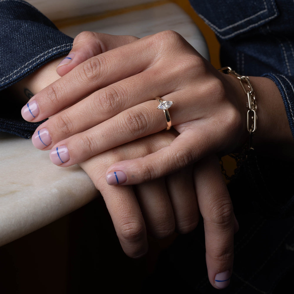 Elegant marquise lab diamond cigar band solitaire engagement ring with refined proportions and bold modern aesthetic