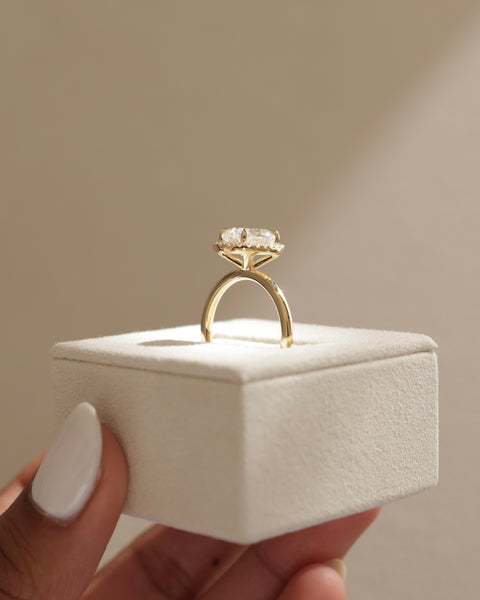 Elegant oval cut lab diamond halo solitaire engagement ring with balanced proportions and romantic styling