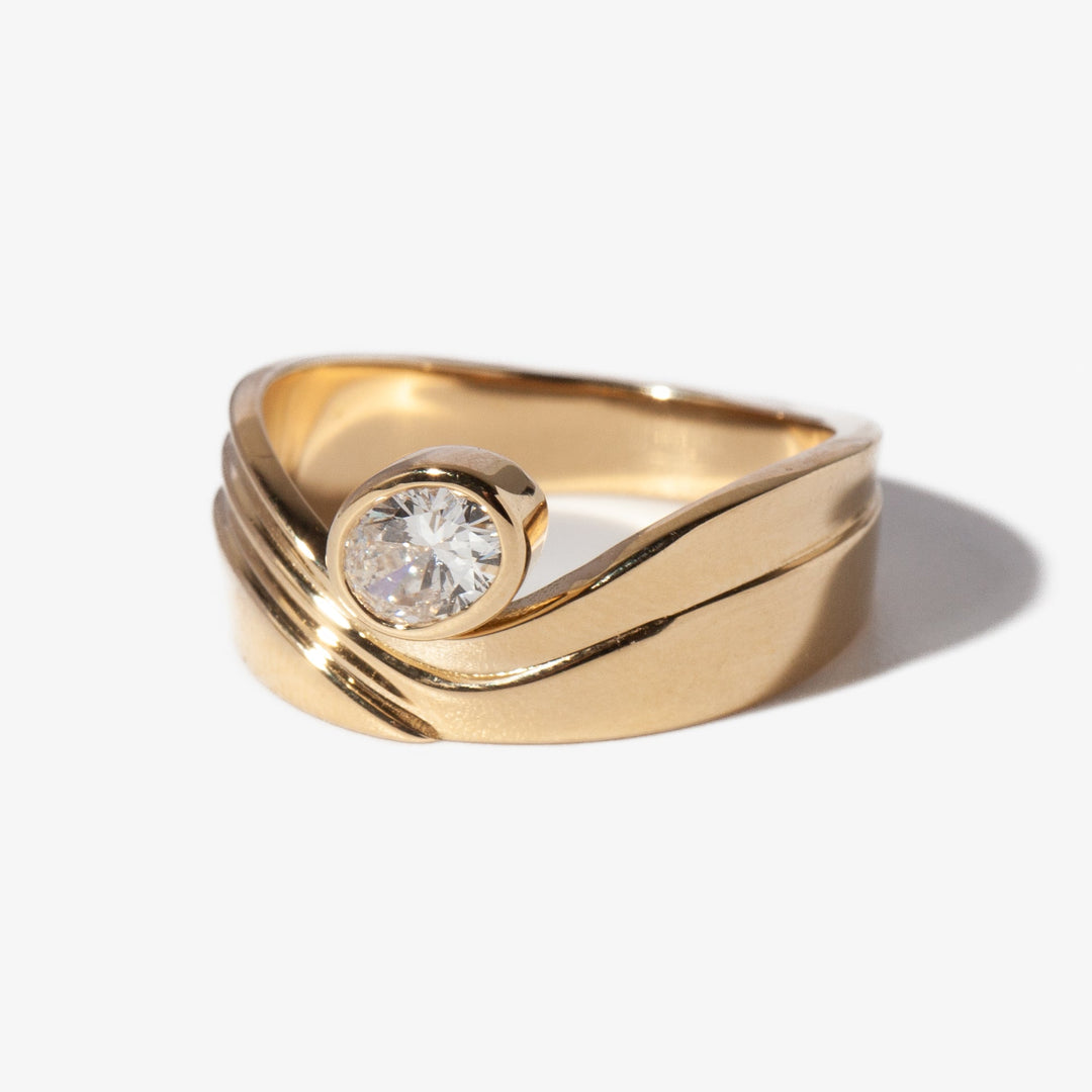 Elegant oval lab grown diamond monte engagement ring with E VS1 clarity and refined raised solitaire setting