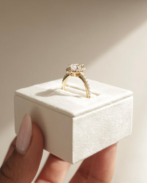 Elegant pear cut lab diamond halo pavé engagement ring with refined proportions and sparkling romantic design