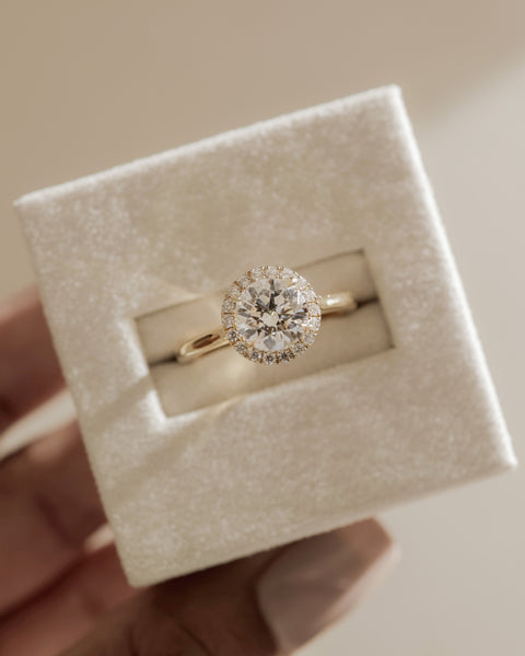 Elegant round lab grown diamond halo solitaire engagement ring with balanced proportions and sophisticated detailing