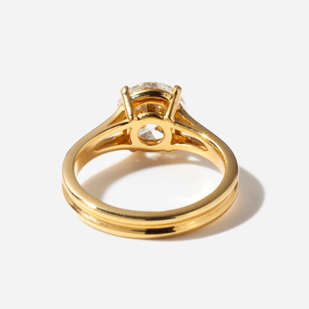 Elegant round lab diamond engagement ring with a split shank band that draws attention to the center stone