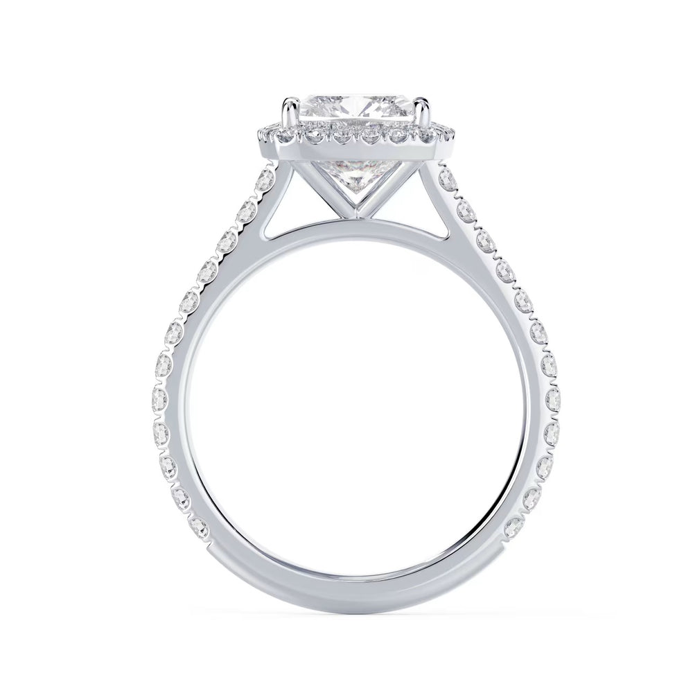 Close-up of an elongated cushion lab grown diamond halo cathedral pave engagement ring highlighting soft rectangular cushion brilliance