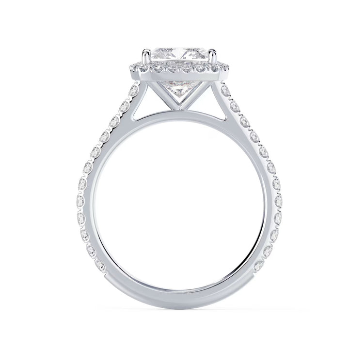 Close-up of an elongated cushion lab grown diamond halo cathedral pave engagement ring highlighting soft rectangular cushion brilliance