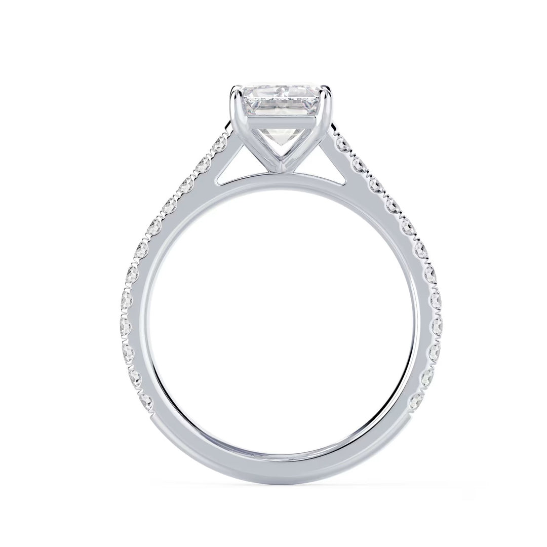 Close-up of an emerald cut lab grown diamond cathedral pave engagement ring highlighting step-cut facets and pavé band sparkle
