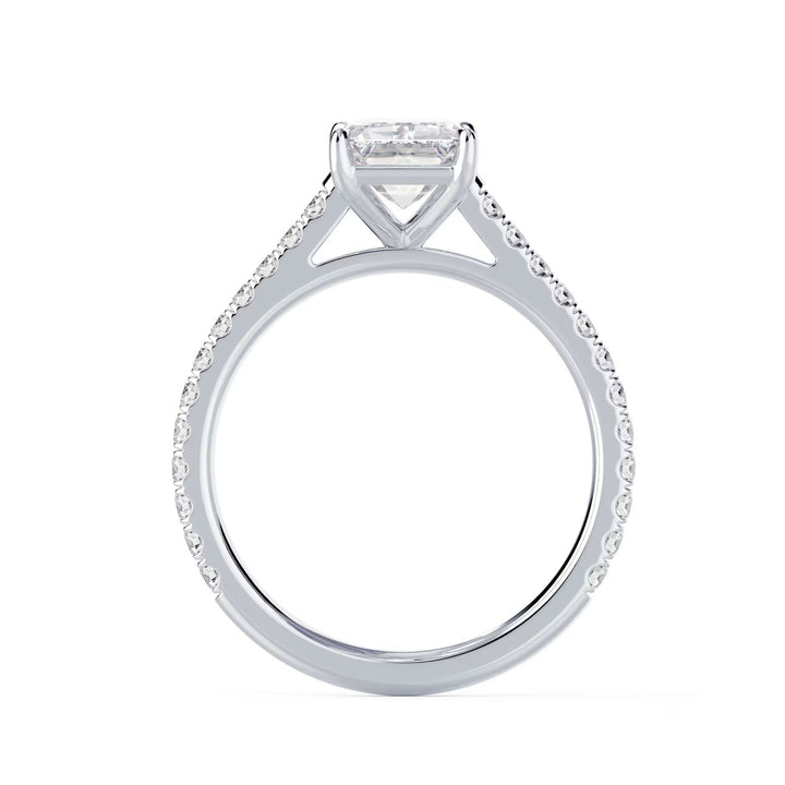 Close-up of an emerald cut lab grown diamond cathedral pave engagement ring highlighting step-cut facets and pavé band sparkle