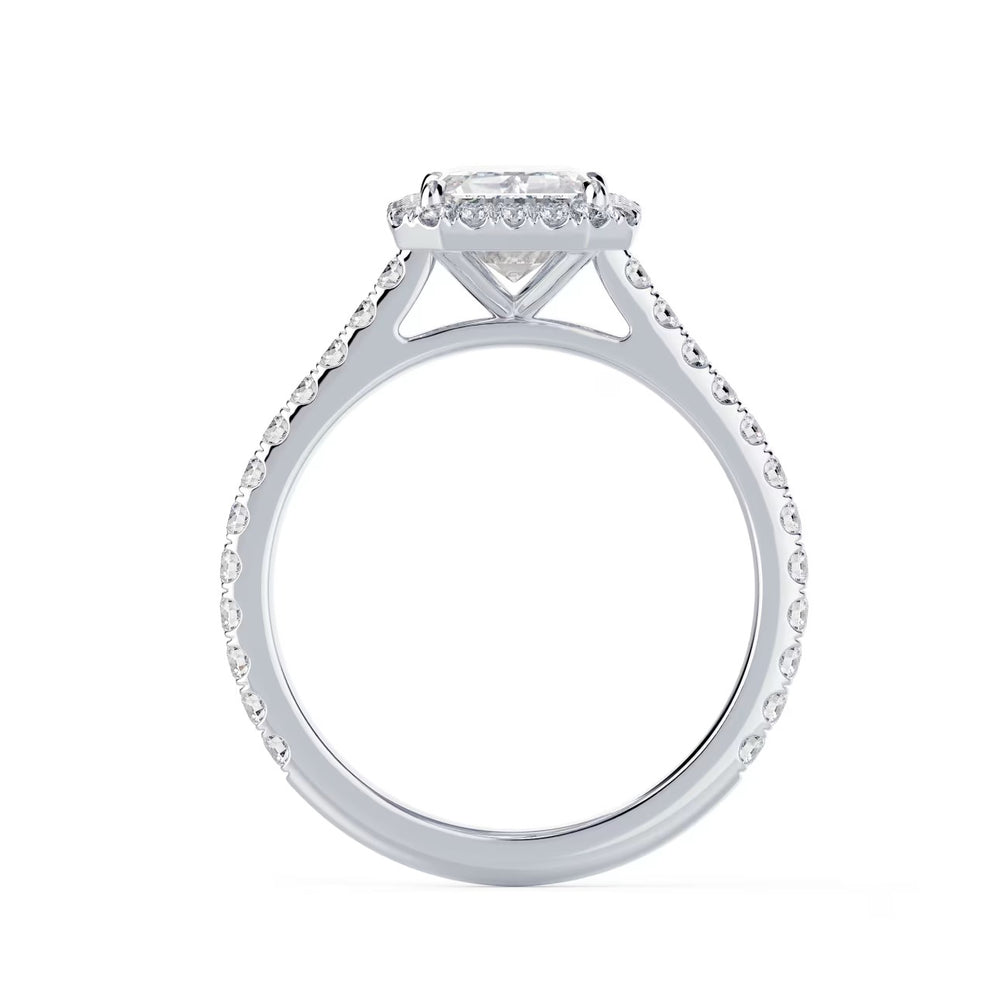 Close-up of an emerald cut lab grown diamond halo cathedral pave engagement ring highlighting step-cut facets and pavé detailing