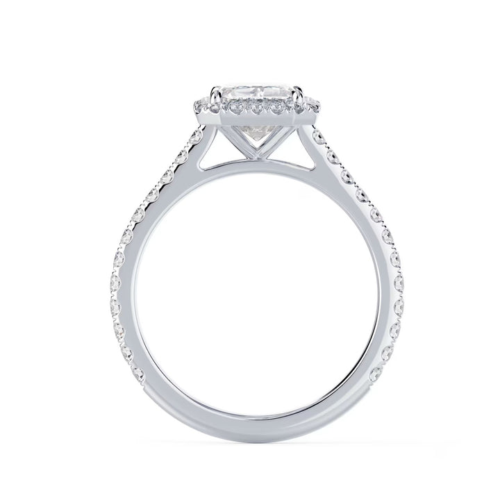 Close-up of an emerald cut lab grown diamond halo cathedral pave engagement ring highlighting step-cut facets and pavé detailing