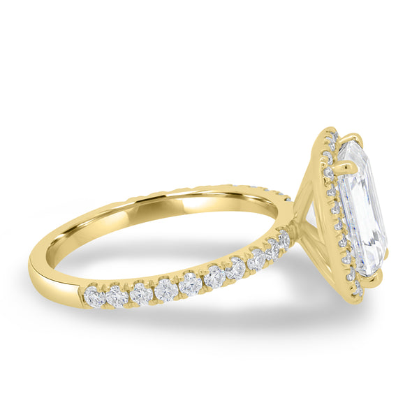 Emerald cut lab diamond halo engagement ring featuring a sparkling halo frame and pavé-set accents