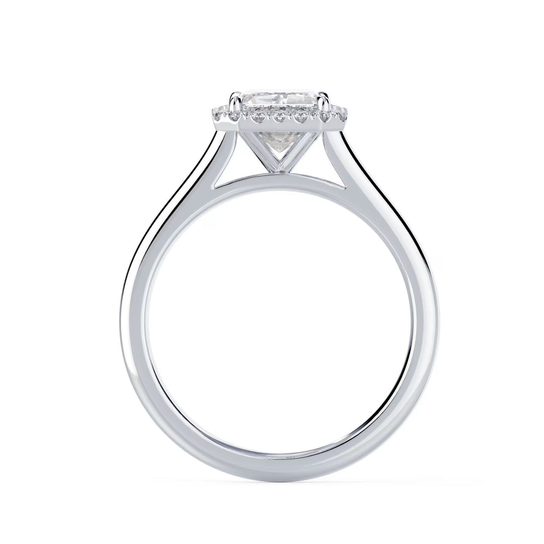 Close-up of an emerald cut lab grown diamond halo solitaire engagement ring highlighting step-cut elegance and halo framing