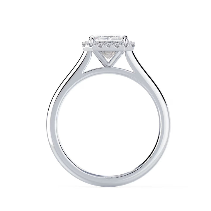 Close-up of an emerald cut lab grown diamond halo solitaire engagement ring highlighting step-cut elegance and halo framing