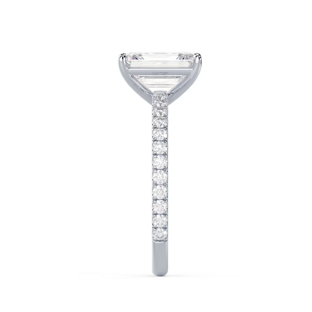 Close-up of an emerald cut lab grown diamond pave engagement ring highlighting step-cut facets and pavé band sparkle